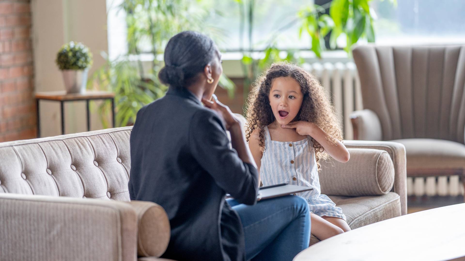 Child taking part in an assessment session with a psychologist